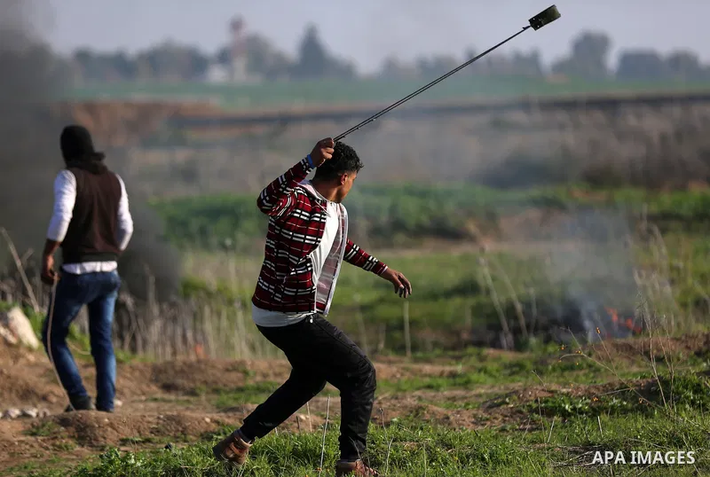 Palestinian protesters clash with Israeli security forces, against US President Donald Trump's decision to recognise Jerusalem as the capital of Israel, near the border with Israel, east of Gaza City on February 2, 2018....