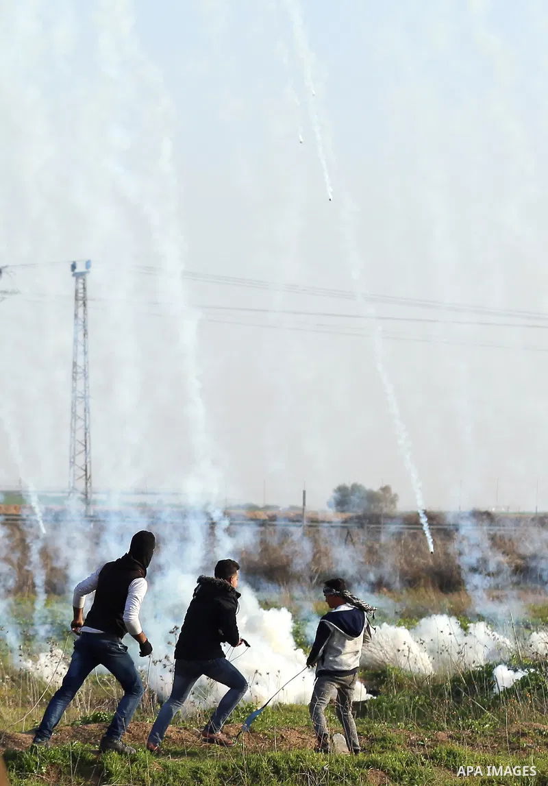 Palestinian protesters clash with Israeli security forces, against US President Donald Trump's decision to recognise Jerusalem as the capital of Israel, near the border with Israel, east of Gaza City on February 2, 2018....