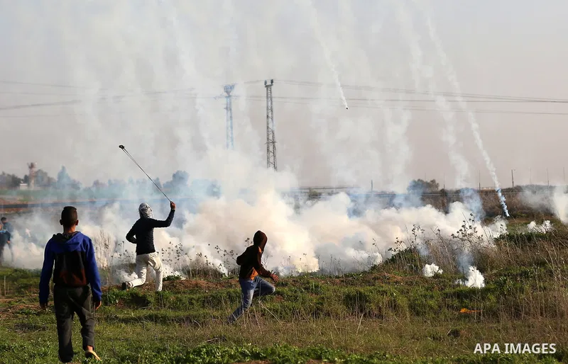 Palestinian protesters clash with Israeli security forces, against US President Donald Trump's decision to recognise Jerusalem as the capital of Israel, near the border with Israel, east of Gaza City on February 2, 2018....