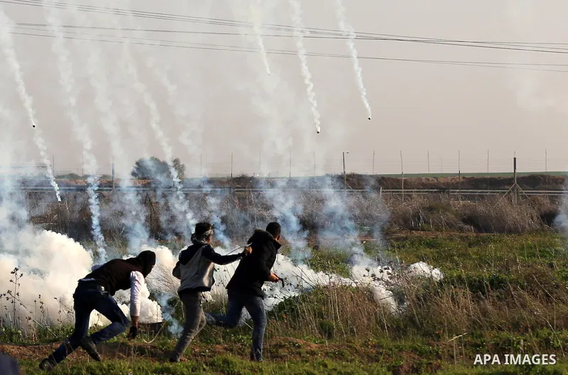 Palestinian protesters clash with Israeli security forces, against US President Donald Trump's decision to recognise Jerusalem as the capital of Israel, near the border with Israel, east of Gaza City on February 2, 2018....