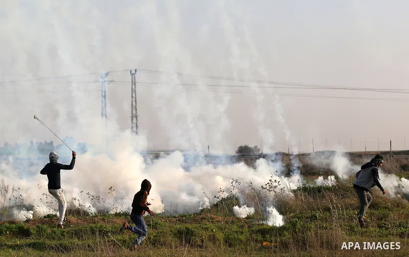 Palestinian protesters clash with Israeli security forces, against US President Donald Trump's decision to recognise Jerusalem as the capital of Israel, near the border with Israel, east of Gaza City on February 2, 2018....
