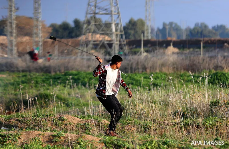 Palestinian protesters clash with Israeli security forces, against US President Donald Trump's decision to recognise Jerusalem as the capital of Israel, near the border with Israel, east of Gaza City on February 2, 2018....
