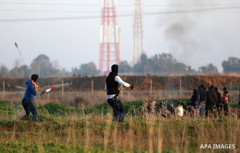 Palestinian protesters clash with Israeli security forces, against US President Donald Trump's decision to recognise Jerusalem as the capital of Israel, near the border with Israel, east of Gaza City on February 2, 2018....