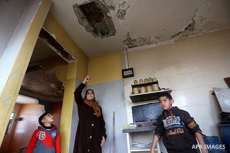 Palestinians check the damage after an attack carried out by the Israeli army in Beit Hanun in the northern Gaza Strip on February 2, 2018. Israeli forces struck a Hamas position in Gaza early today after a rocket was fi...