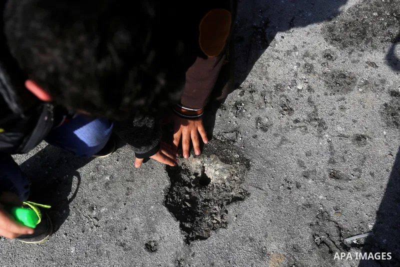 Palestinians check the damage after an attack carried out by the Israeli army in Beit Hanun in the northern Gaza Strip on February 2, 2018. Israeli forces struck a Hamas position in Gaza early today after a rocket was fi...