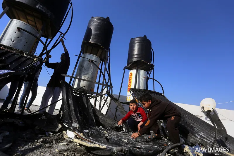 Palestinians check the damage after an attack carried out by the Israeli army in Beit Hanun in the northern Gaza Strip on February 2, 2018. Israeli forces struck a Hamas position in Gaza early today after a rocket was fi...
