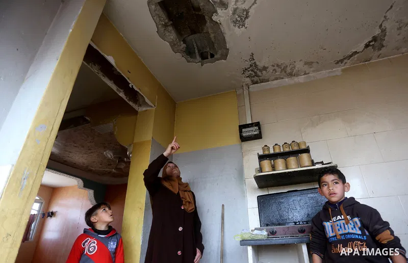 Palestinians check the damage after an attack carried out by the Israeli army in Beit Hanun in the northern Gaza Strip on February 2, 2018. Israeli forces struck a Hamas position in Gaza early today after a rocket was fi...