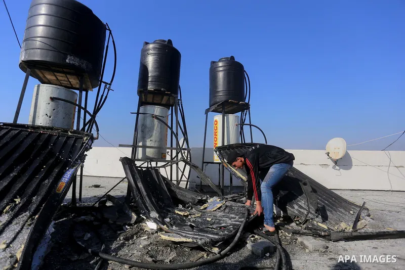 Palestinians check the damage after an attack carried out by the Israeli army in Beit Hanun in the northern Gaza Strip on February 2, 2018. Israeli forces struck a Hamas position in Gaza early today after a rocket was fi...