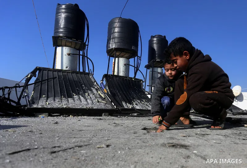 Palestinians check the damage after an attack carried out by the Israeli army in Beit Hanun in the northern Gaza Strip on February 2, 2018. Israeli forces struck a Hamas position in Gaza early today after a rocket was fi...