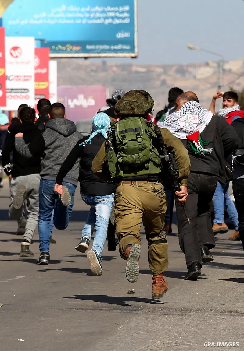 Palestinian protesters clash with Israeli security forces following a demonstration near the Hawara checkpoint, south of the West Bank city of Nablus on February 2, 2018, as demonstrations continue over the US president'...