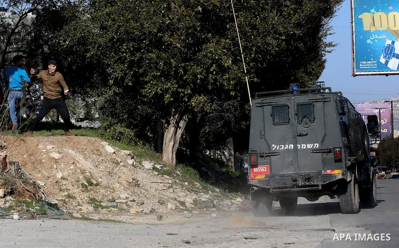 Palestinian protesters clash with Israeli security forces following a demonstration near the Hawara checkpoint, south of the West Bank city of Nablus on February 2, 2018, as demonstrations continue over the US president'...