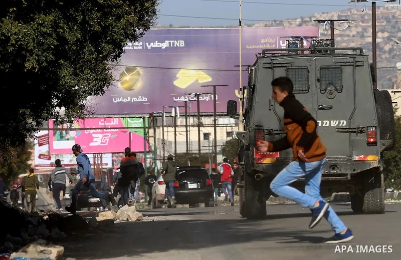 Palestinian protesters clash with Israeli security forces following a demonstration near the Hawara checkpoint, south of the West Bank city of Nablus on February 2, 2018, as demonstrations continue over the US president'...