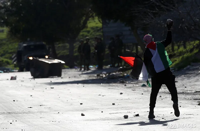 Palestinian protesters clash with Israeli security forces following a demonstration near the Hawara checkpoint, south of the West Bank city of Nablus on February 2, 2018, as demonstrations continue over the US president'...