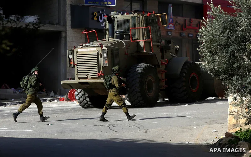Israeli security forces take position during a search operation for Palestinians suspected of carrying out attacks in the West Bank village of Zababdeh, north of Jenin on February 3, 2018. Photo by Ayman Ameen