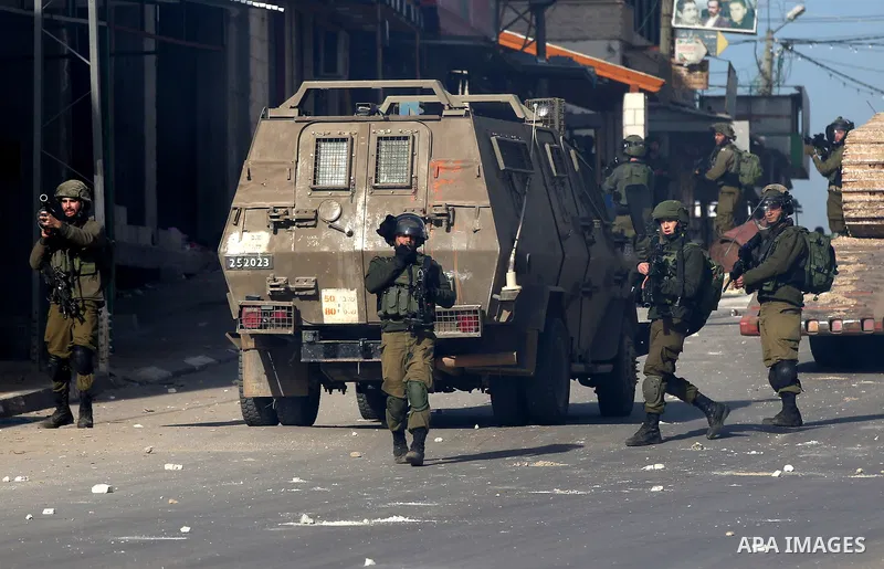 Israeli security forces take position during a search operation for Palestinians suspected of carrying out attacks in the West Bank village of Zababdeh, north of Jenin on February 3, 2018. Photo by Ayman Ameen