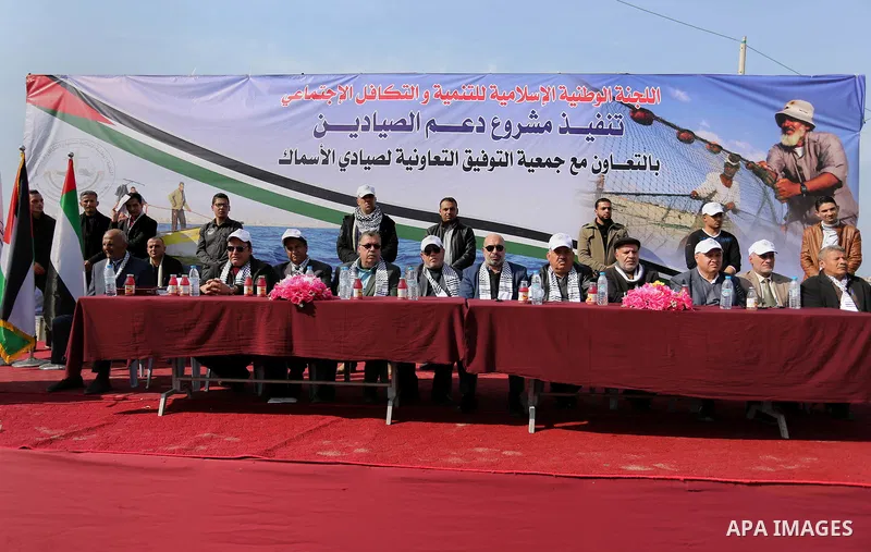 Palestinian fishermen attend a ceremony of support Palestinian fishermen project funded by the national islamic committee for development and social solidarity, in Gaza sea port on February 3, 2018. Photo by Ashraf Amra