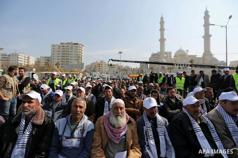 Palestinian fishermen attend a ceremony of support Palestinian fishermen project funded by the national islamic committee for development and social solidarity, in Gaza sea port on February 3, 2018. Photo by Ashraf Amra