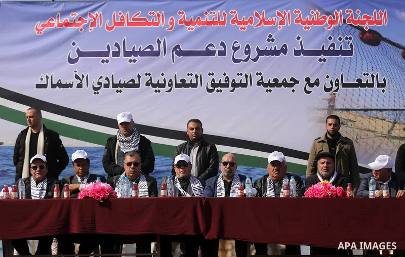 Palestinian fishermen attend a ceremony of support Palestinian fishermen project funded by the national islamic committee for development and social solidarity, in Gaza sea port on February 3, 2018. Photo by Ashraf Amra
