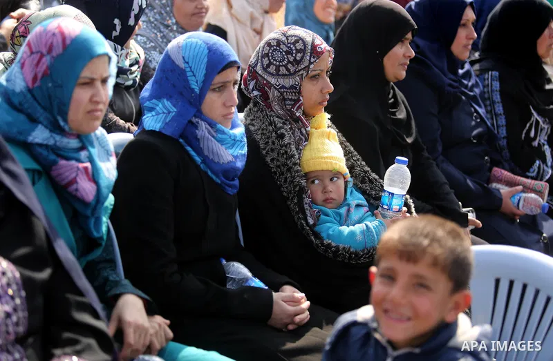 Palestinian women attend a ceremony of support Palestinian fishermen project funded by the national islamic committee for development and social solidarity, in Gaza sea port on February 3, 2018. Photo by Ashraf Amra