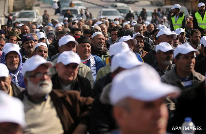 Palestinian fishermen attend a ceremony of support Palestinian fishermen project funded by the national islamic committee for development and social solidarity, in Gaza sea port on February 3, 2018. Photo by Ashraf Amra