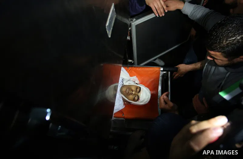 Relatives of Palestinian Ahmed Abu Obeid, 19, who was shot dead during clashes with Israeli security foces mourn over his body at a hospital morgue, in the West Bank city of Jenin, on February. 03, 2018. Photo by Shadi J...