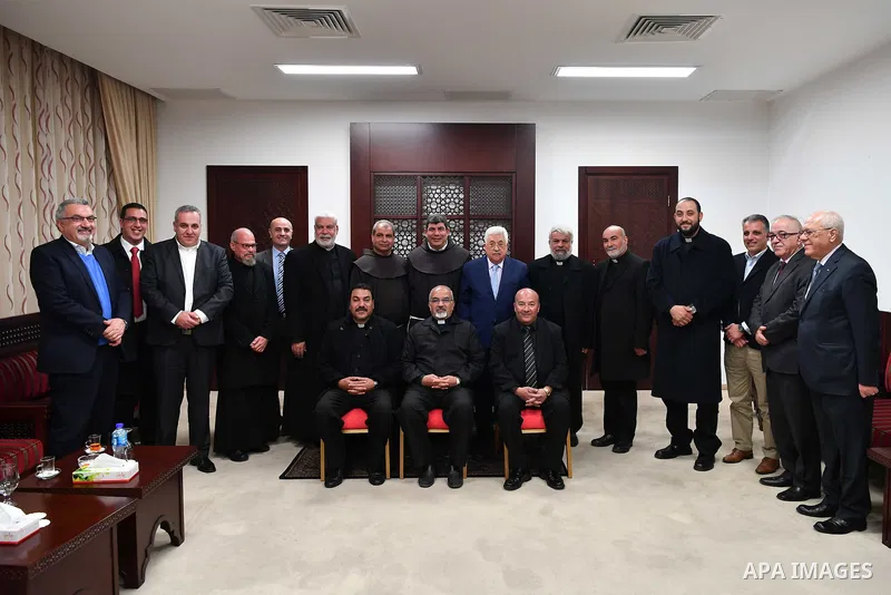 Palestinian President Mahmoud Abbas meets with the monks of the Egyptian Coptic Catholic Church, at his headquarter in the West Bank city of Ramallah on February 5, 2018. Photo by Thaer Ganaim