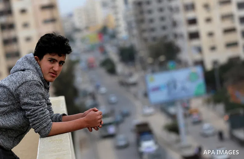A Palestinian boy looks as truck drivers take part in a protest against the siege on the Gaza Strip, on February 6, 2018 in Gaza City. Israel has maintained a siege on Gaza for a decade which it says is necessary to limi...