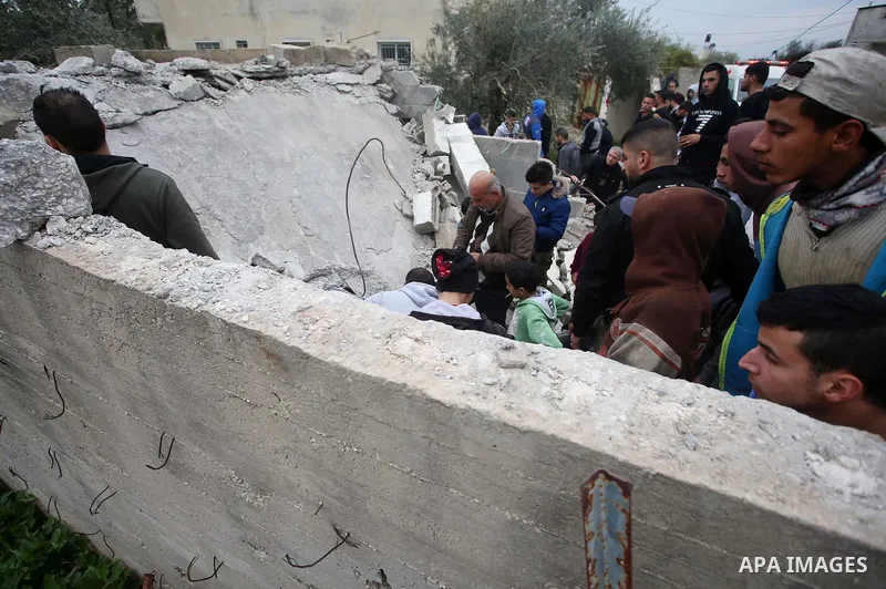 Palestinians check the damage where Israeli forces killed Palestinian gunman Ahmad Nasr Jarrar in Yamoun in the occupied West Bank, February 6, 2018. Photo by Ayman Ameen