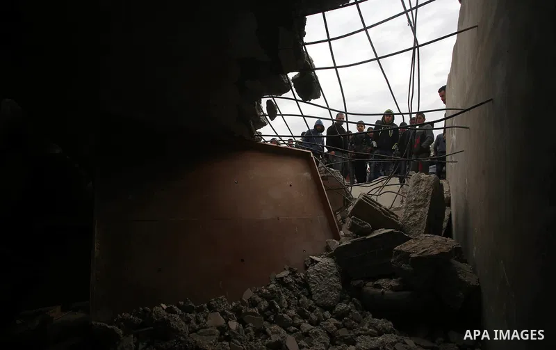 Palestinians check the damage where Israeli forces killed Palestinian gunman Ahmad Nasr Jarrar in Yamoun in the occupied West Bank, February 6, 2018. Photo by Ayman Ameen