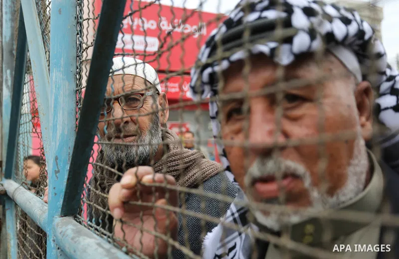 Palestinians take part in a protest against the US move to freeze funding for the UN agency for Palestinian refugees in the southern Gaza Strip town of Rafah on February 6, 2018. Photo by Ashraf Amra