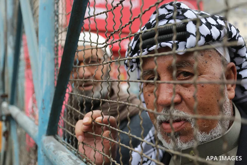 Palestinians take part in a protest against the US move to freeze funding for the UN agency for Palestinian refugees in the southern Gaza Strip town of Rafah on February 6, 2018. Photo by Ashraf Amra
