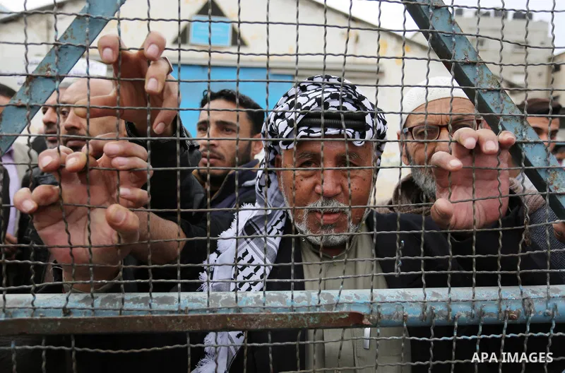 Palestinians take part in a protest against the US move to freeze funding for the UN agency for Palestinian refugees in the southern Gaza Strip town of Rafah on February 6, 2018. Photo by Ashraf Amra