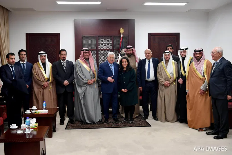 Palestinian President, Mahmoud Abbas, meets with Kuwaiti Minister of Trade, Youth and Sports Khaled Al-Rawdan, in the West bank city of Ramallah, on February 6, 2018. Photo by Osama Falah