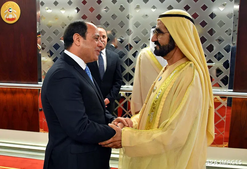 Egyptian President Abdel Fattah al-Sisi shakes hands with Sheikh Mohammed bin Rashid Al Maktoum, Prime Minister and Vice-President of the United Arab Emirates and Ruler of Dubai, in Abu Dhabi, United Arab Emirates on Feb...