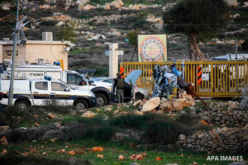 Israeli forces gather at the entrance of the Israeli settlement of Karmei Tzur, north of Hebron in the occupied West Bank, after a Palestinian stabbed a security guard and was shot dead, on February 7, 2018. Photo by Wis...