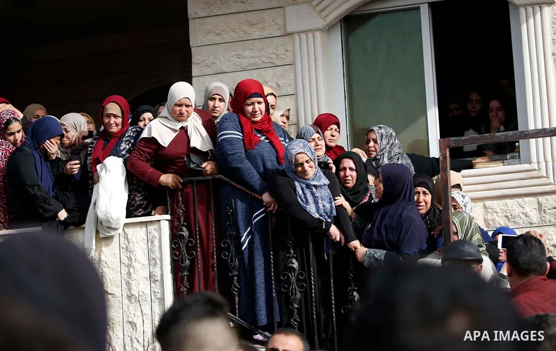 Relatives of Palestinian assailant react outside his house near Hebron, in the occupied West Bank February 7, 2018. Photo by Wisam Hashlamoun