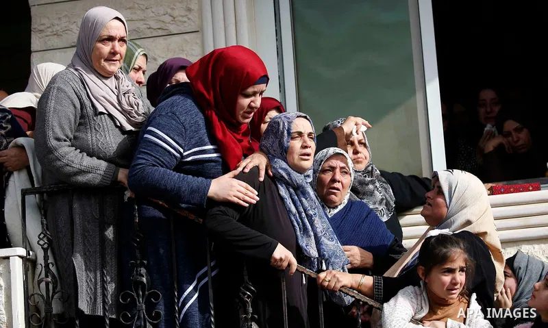 Relatives of Palestinian assailant react outside his house near Hebron, in the occupied West Bank February 7, 2018. Photo by Wisam Hashlamoun