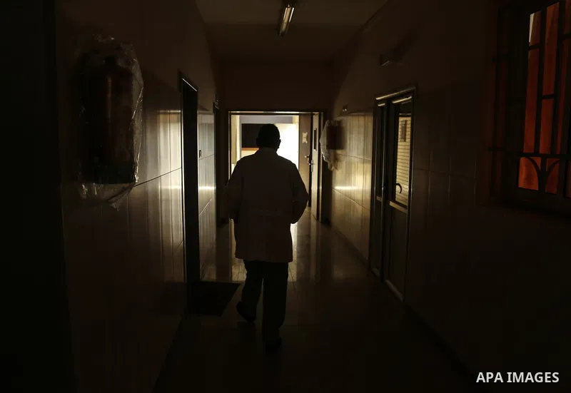 An employee of the Palestinian health ministry walks through the corridor at Durra hospital in Gaza City, after it stopped its services on February 7, 2018 after it ran out of fuel. Seven medical centers in Gaza have sto...