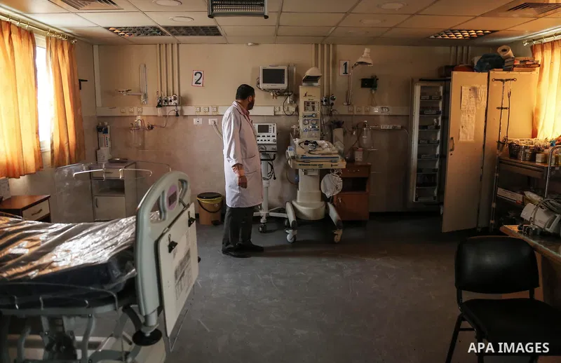An employee of the Palestinian health ministry checks the Durra hospital in Gaza City after it stopped its services on February 7, 2018 after it ran out of fuel. Seven medical centers in Gaza have stopped services due to...