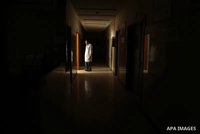 An employee of the Palestinian health ministry walks through the corridor at Durra hospital in Gaza City, after it stopped its services on February 7, 2018 after it ran out of fuel. Seven medical centers in Gaza have sto...