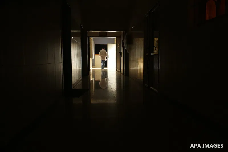 An employee of the Palestinian health ministry walks through the corridor at Durra hospital in Gaza City, after it stopped its services on February 7, 2018 after it ran out of fuel. Seven medical centers in Gaza have sto...