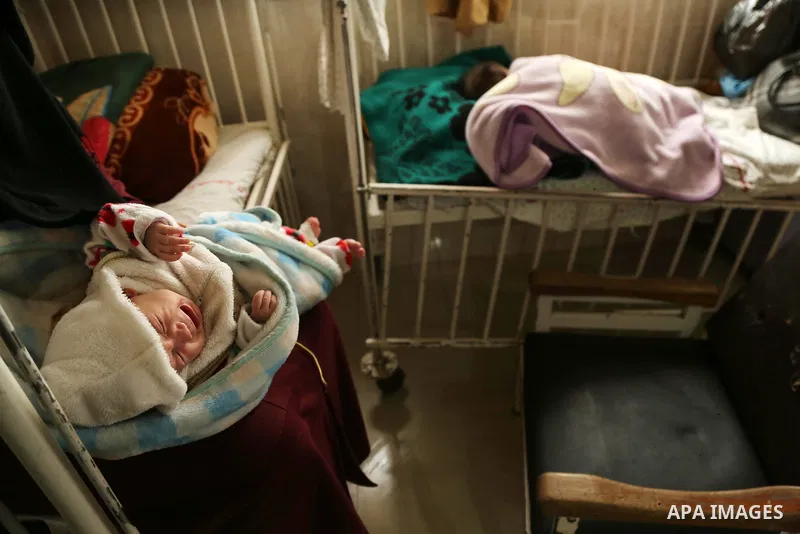 A child is seen in Dora hospital in Gaza City after it stopped its services on February 7, 2018 after it ran out of fuel. Seven medical centers in Gaza have stopped services due to lack of fuel to power generators. Ashra...