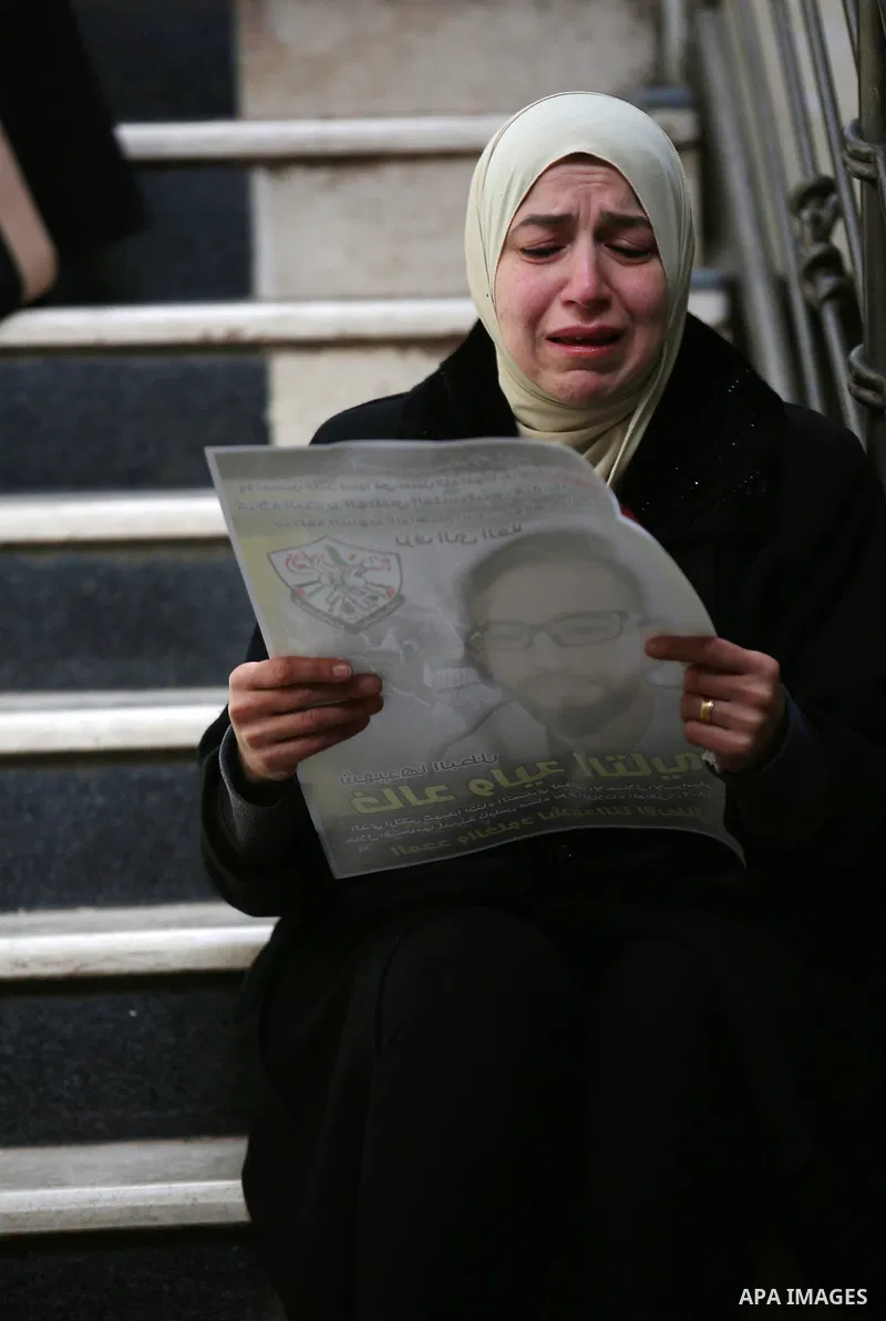 A relative reacts during the funeral of Khaled Taeh, a Palestinian, who was shot dead by Israeli during a raid that led to confrontations with residents, in the occupied West Bank city of Nablus, February 7, 2018. Photo...
