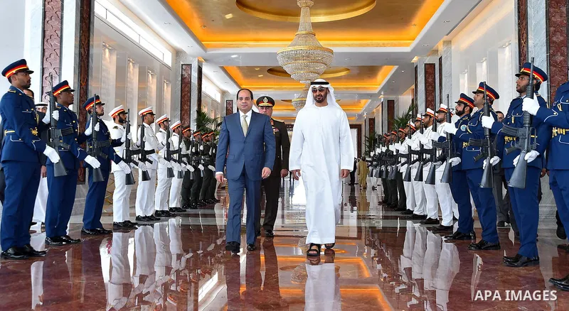 Egyptian President Abdel Fattah al-Sisi walks alongside with Abu Dhabi Crown Prince Mohammed bin Zayed al-Nahyan, before he leavese Abu Dhabi, on February 07, 2018. Photo by Egyptian President Office