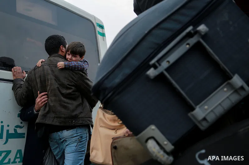 Palestinians wait for travel permits to cross into Egypt through the Rafah border crossing after it was opened by Egyptian authorities for humanitarian cases on the first time in 2018, in the southern Gaza Strip on Febru...
