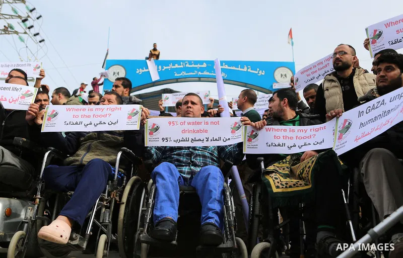 Wounded and disabled Palestinians take part in a protest against the siege on the Gaza Strip, at Erez crossing, in the northern Gaza Strip, on February 8, 2018. Israel has maintained a siege on Gaza for a decade which it...