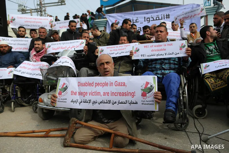 Wounded and disabled Palestinians take part in a protest against the siege on the Gaza Strip, at Erez crossing, in the northern Gaza Strip, on February 8, 2018. Israel has maintained a siege on Gaza for a decade which it...