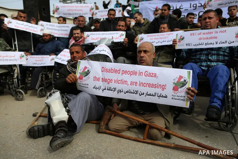 Wounded and disabled Palestinians take part in a protest against the siege on the Gaza Strip, at Erez crossing, in the northern Gaza Strip, on February 8, 2018. Israel has maintained a siege on Gaza for a decade which it...