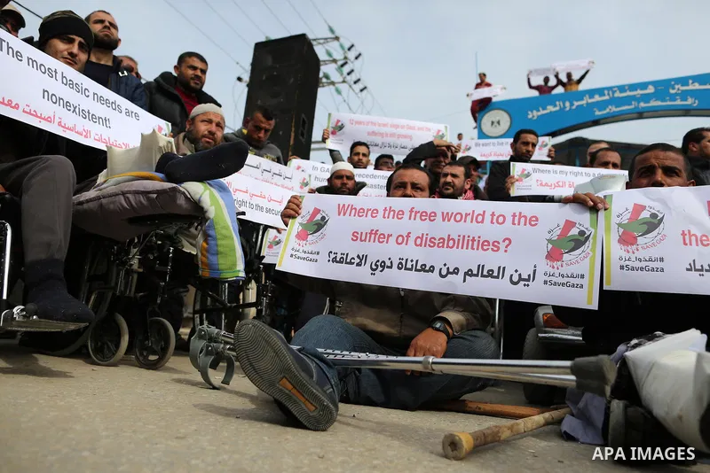 Wounded and disabled Palestinians take part in a protest against the siege on the Gaza Strip, at Erez crossing, in the northern Gaza Strip, on February 8, 2018. Israel has maintained a siege on Gaza for a decade which it...