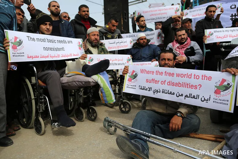 Wounded and disabled Palestinians take part in a protest against the siege on the Gaza Strip, at Erez crossing, in the northern Gaza Strip, on February 8, 2018. Israel has maintained a siege on Gaza for a decade which it...
